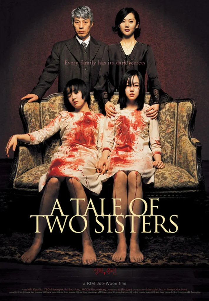 A Tale of Two Sisters (2003) South Korean horror movie poster featuring two young girls sitting on an antique sofa, dressed in white nightgowns soaked in blood. Behind them, a stern-looking man and a composed woman place their hands on the girls' shoulders. The tagline, 'Every family has its dark secrets,' adds to the eerie atmosphere, hinting at the film’s psychological horror themes.