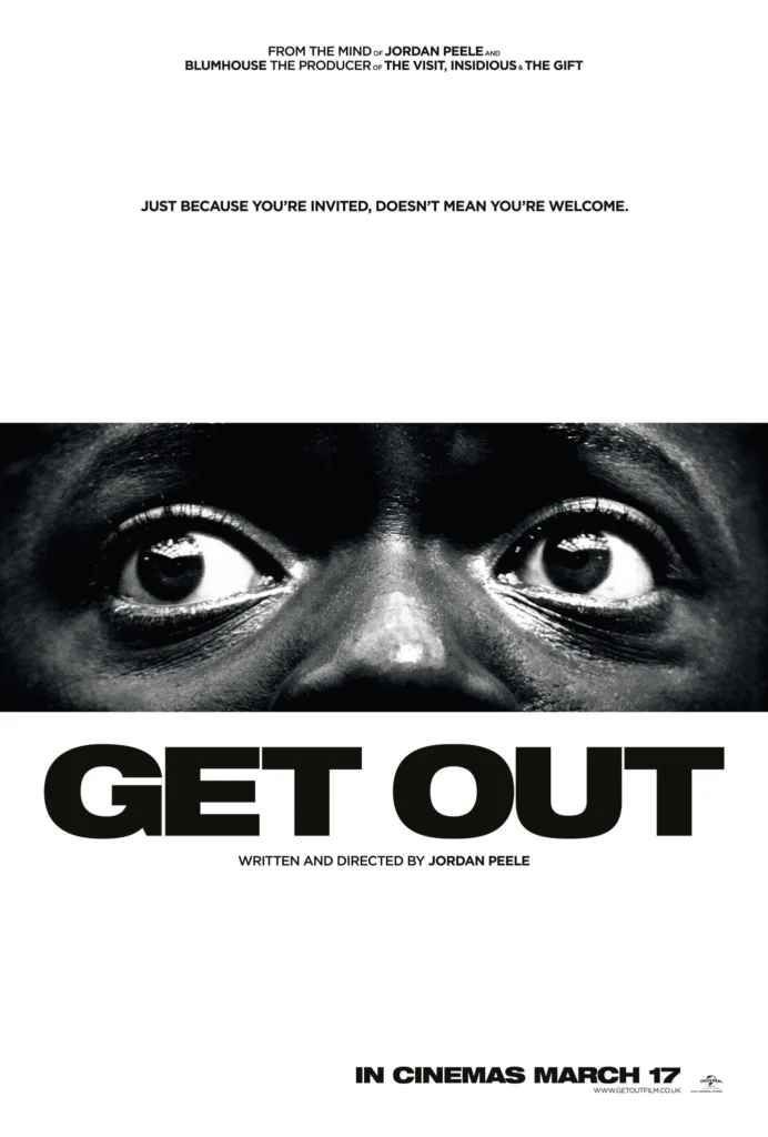 Get Out (2017) movie poster featuring a close-up black-and-white image of wide, terrified eyes, conveying fear and suspense. The bold black title 'GET OUT' dominates the lower portion, with the tagline 'Just because you’re invited, doesn’t mean you’re welcome' above, hinting at the film’s psychological horror and social commentary.