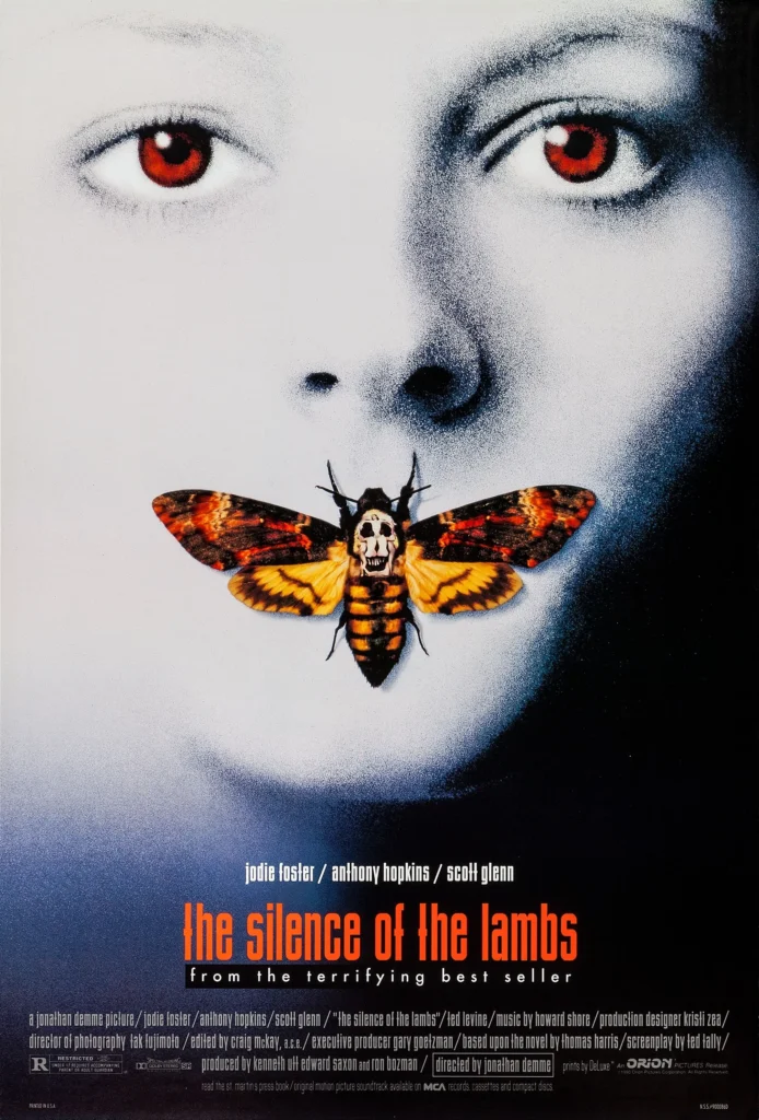 Iconic movie poster for The Silence of the Lambs (1991), featuring a close-up of a pale woman's face with striking red eyes. A Death's-head hawk moth covers her mouth, its pattern resembling a skull, symbolizing silence and psychological horror. The film's title appears in bold orange and white text at the bottom, reinforcing the eerie and unsettling atmosphere of the psychological thriller.