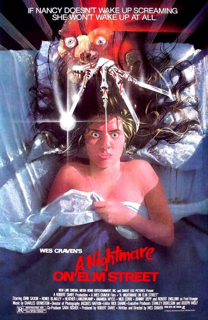 A Nightmare on Elm Street (1984) poster: Nancy wide-eyed in bed as Freddy Krueger’s razor glove hovers over her, light stabbing down.